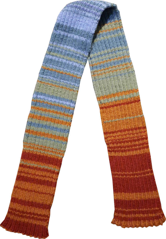 A knitted scarf with stripes of varying widths that progresses from red at the ends of the scarf through the rainbow to purple in the middle.