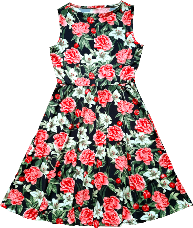 A photo of a sleeveless dress made out of black fabric with large white lilies and pink dahlias.